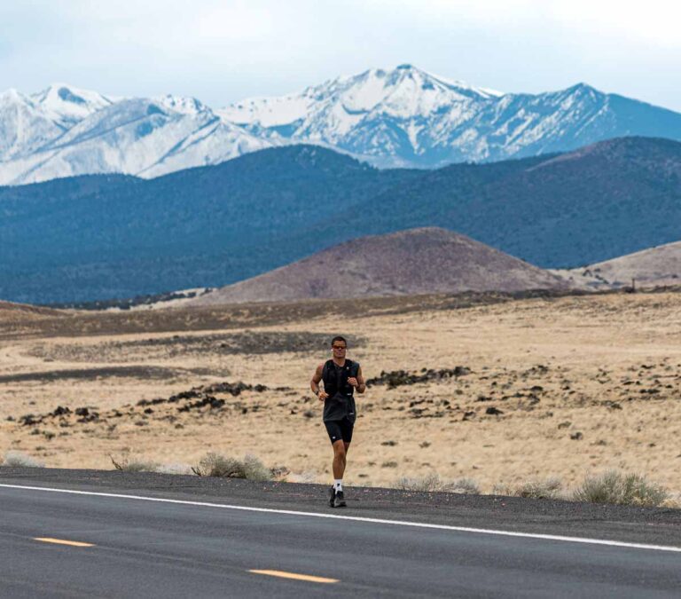 Will Goodge running on a mountain road